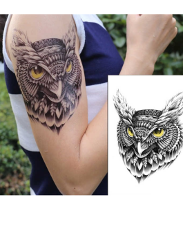 Tatuaż z sową na rękę i udo