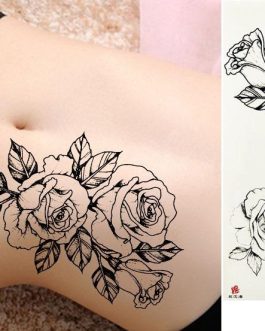 Delikatny damski tatuaż z różą na udo rękę